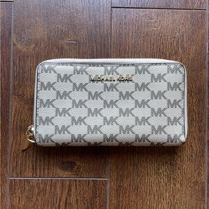 New Michael Kors Zip Around Monogram Wallet. Red Lining.